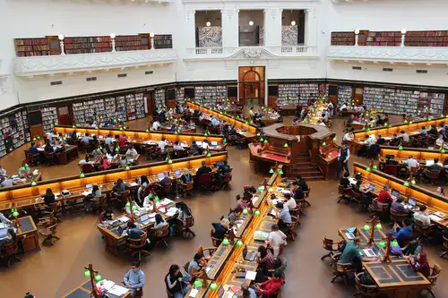 A libary with students studying.